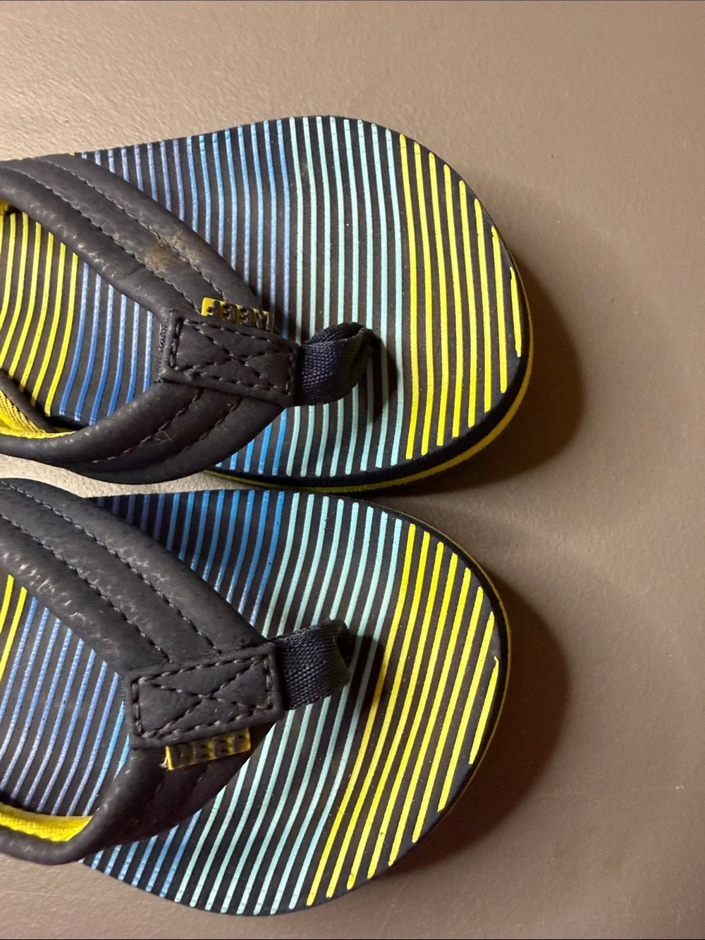Kid’s Reef Blue & Yellow Striped Flip Flops. Size: 1